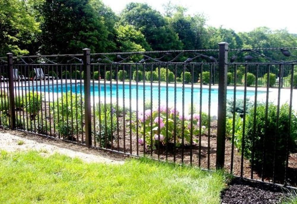 A-black-wrought-iron-fence-or-garden-barrier