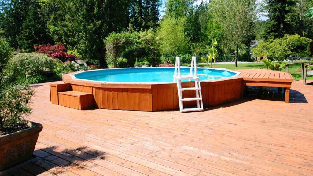 A woody-type above-ground pool with a lovely view around the yard